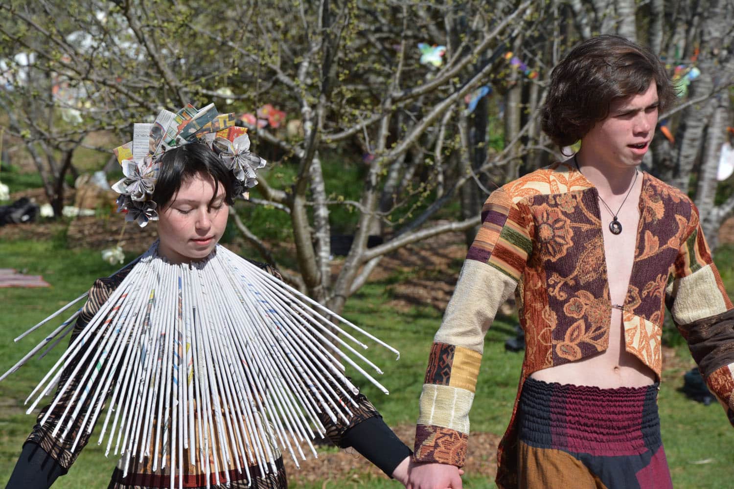 Kindlehill students wearing award-winning recycled outfits celebrate creative imagination, social responsibility, and deep connection with nature.