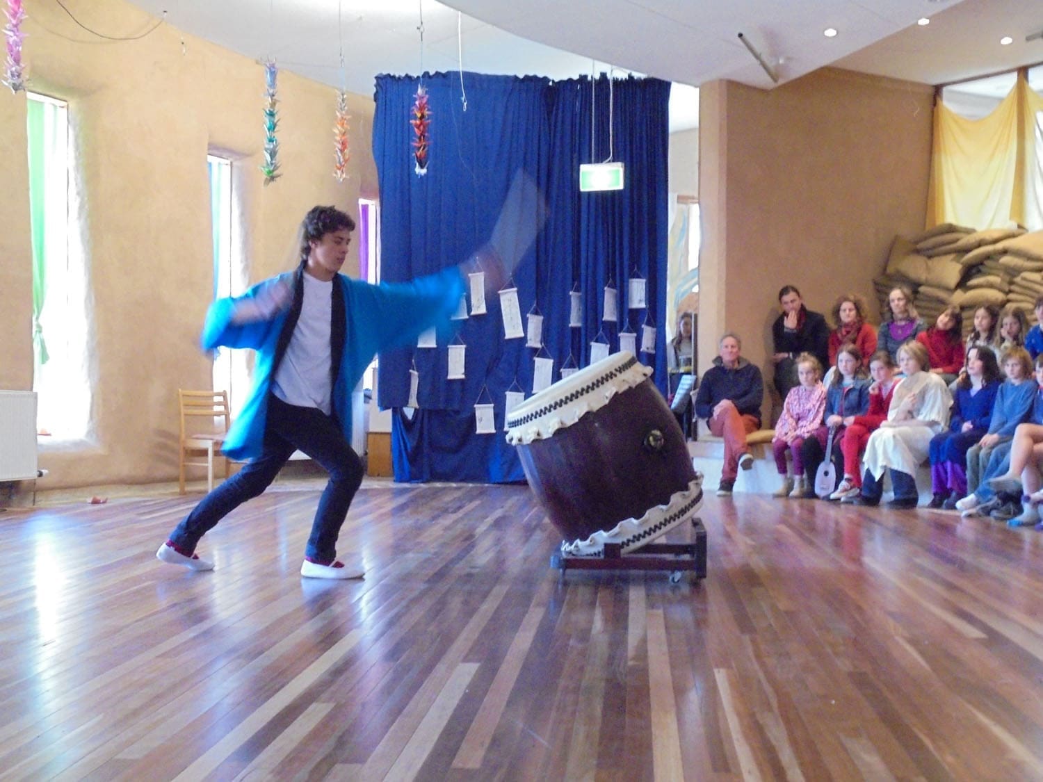 A Kindlehill student performs Taiko drumming to celebrate global harmony and communal peace within the school community.