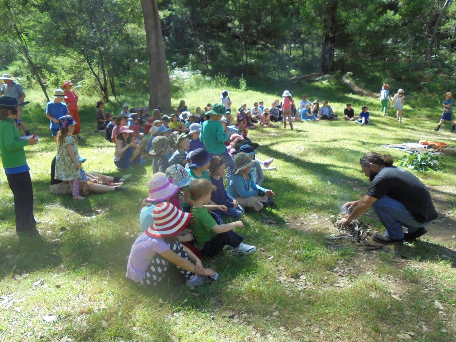 Kindlehill students sit in the Euroka bushland, connecting with Country and First Peoples culture through sacred ceremony.