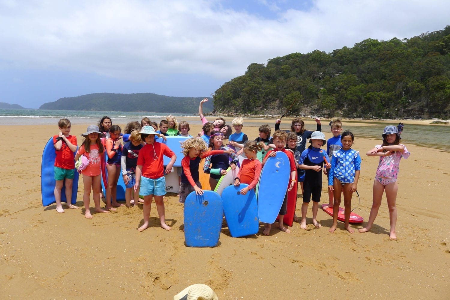 Kindlehill students gather at Patonga Beach, connecting with Country through outdoor education during their mountain to sea camp.