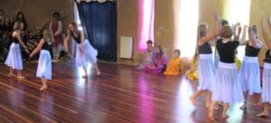 Kindlehill students embody social feeling and creative rhythm through expressive performance at a cooperative Spring community celebration.