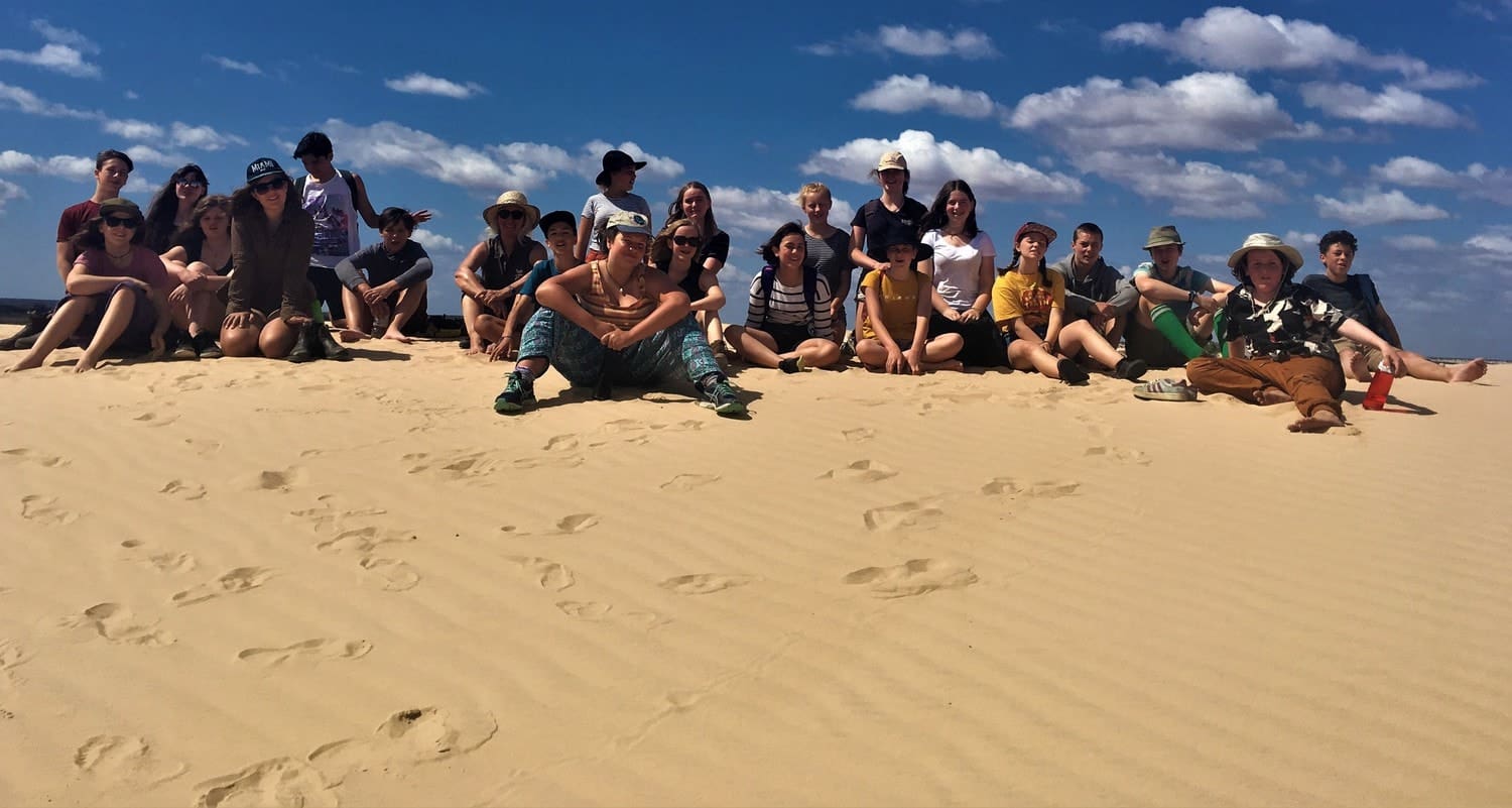 Kindlehill students cultivate Earth citizenship and connection to Country while exploring sand dunes through outdoor geography studies.