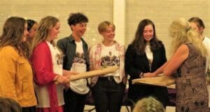 Kindlehill graduates celebrate with laughter, embodying a shared sense of purpose and the warm spirit of community connection.
