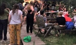 High school students foster community through shared meals and conversation during a bush camp beside the Colo River.