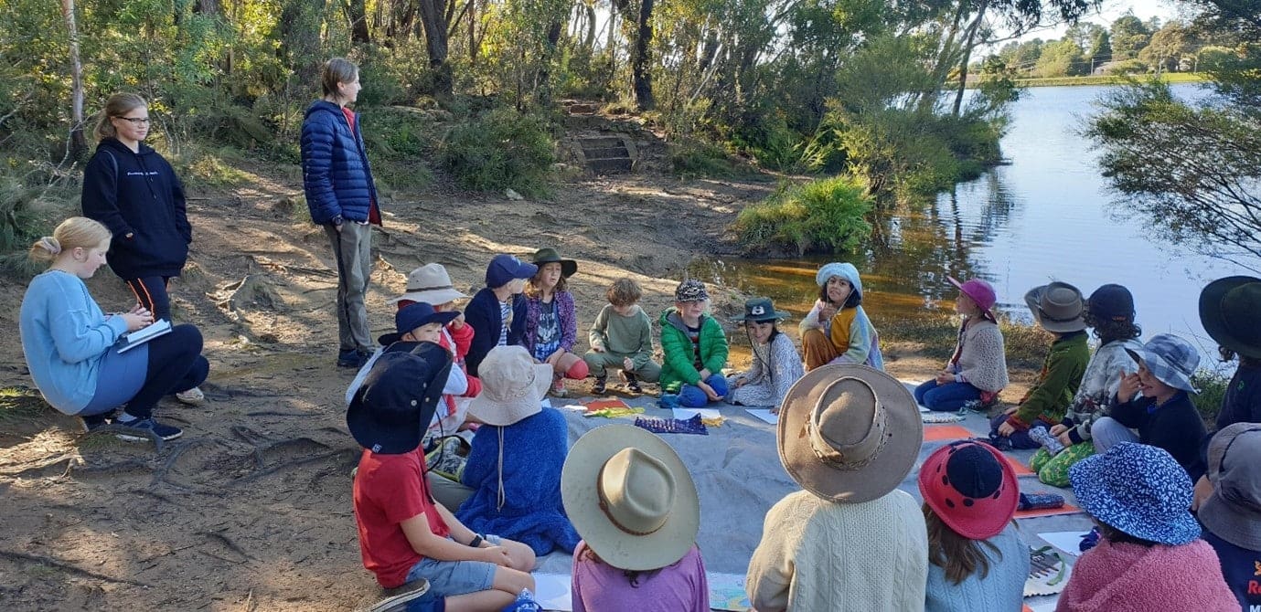 Kindlehill students foster connection at Wentworth Falls Lake, gathering in a bushland circle for nature-based learning and storytelling.