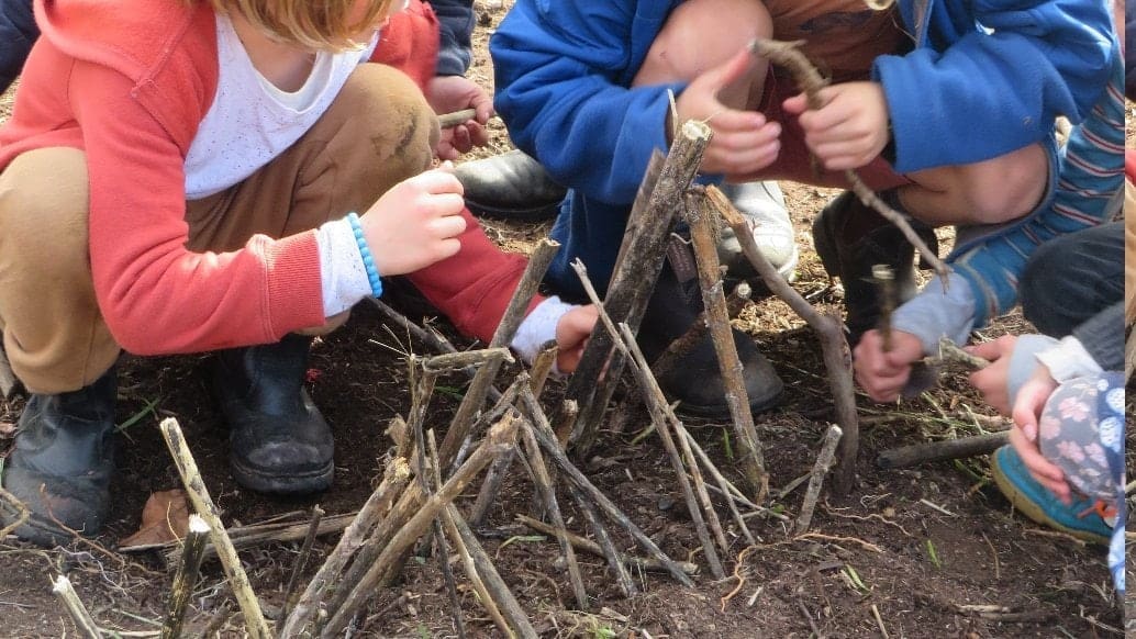 Students collaboratively build a biodynamic compost heap, honouring seasonal rhythms through a hands-on connection with the land.