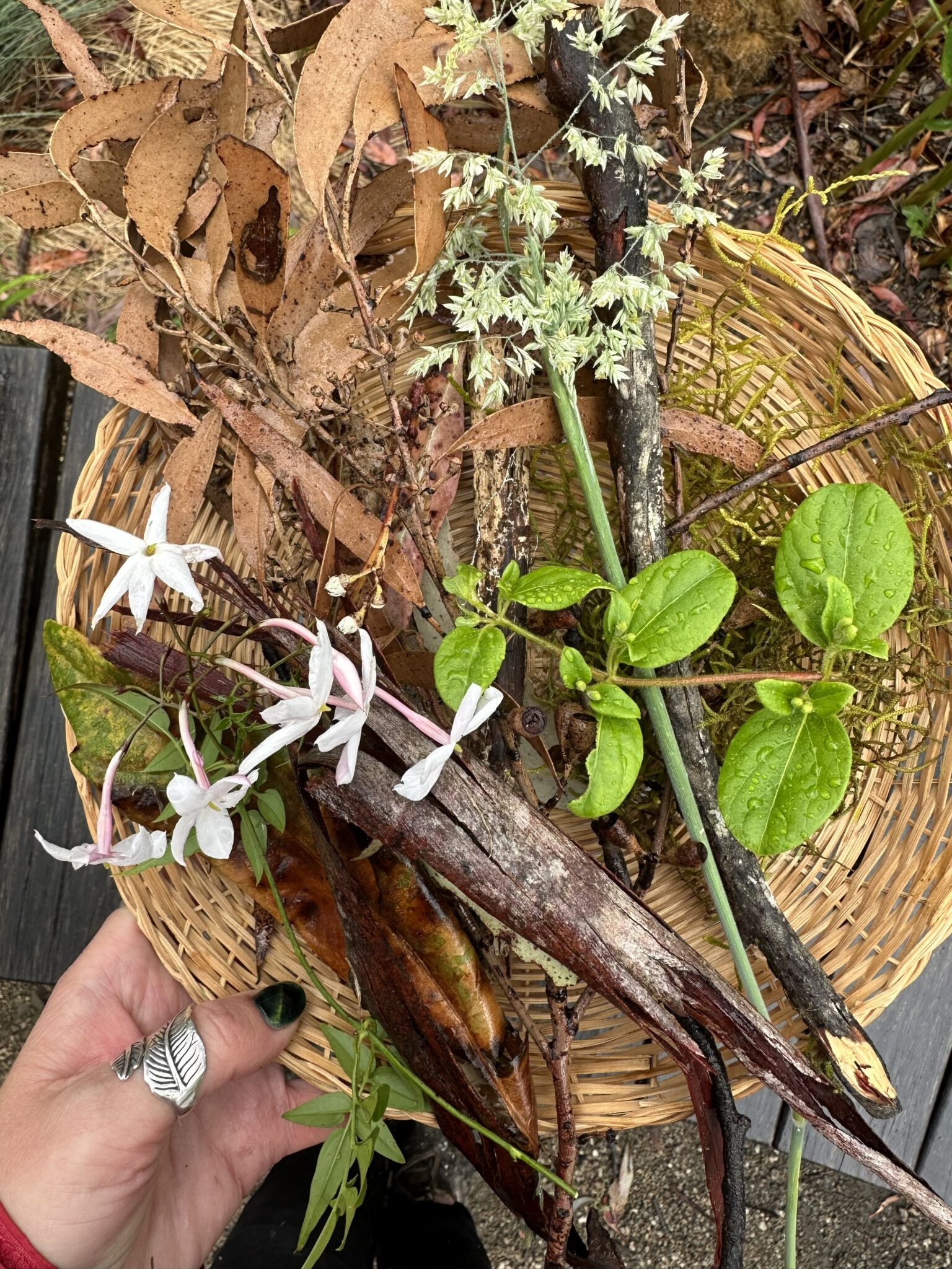Woven basket of foraged leaves and blossoms connects children to the land through nature-centred, creative play.
