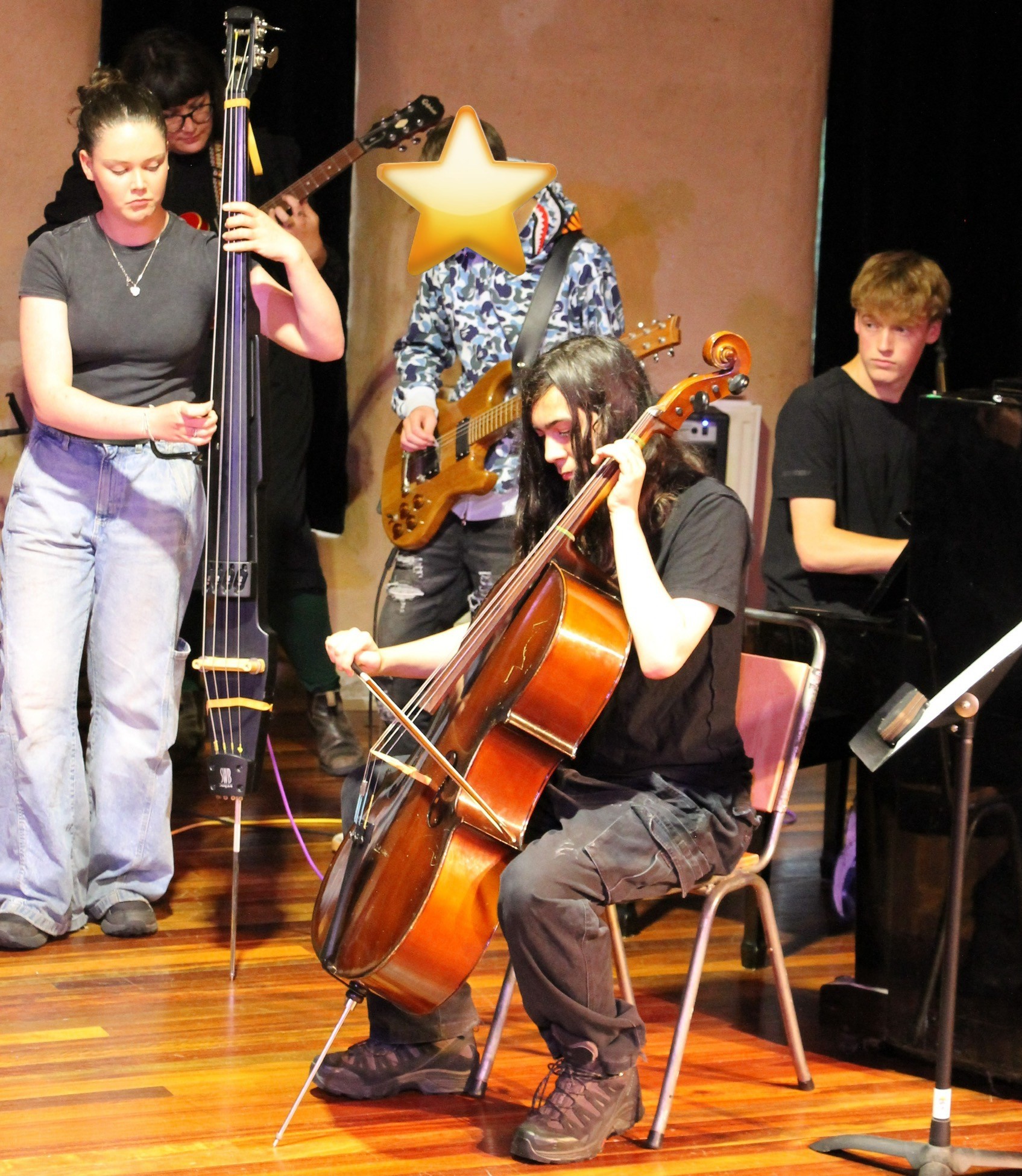 Students harmonise orchestral and modern instruments, demonstrating creative collaboration and artistic expression flowing through head, heart, and hands.