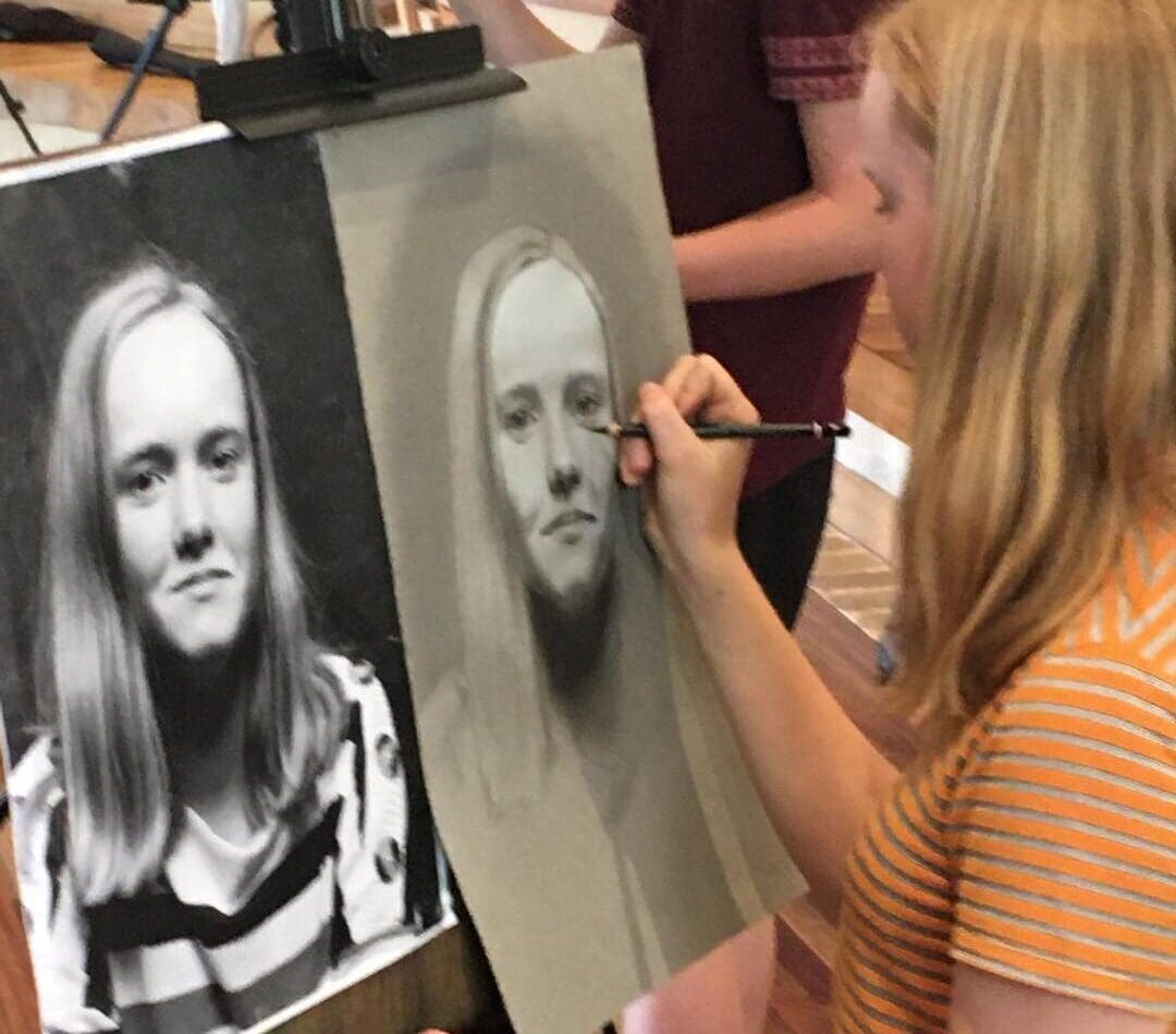 A student honours her developmental journey through self-portraiture, cultivating her identity through head, heart, and hands.
