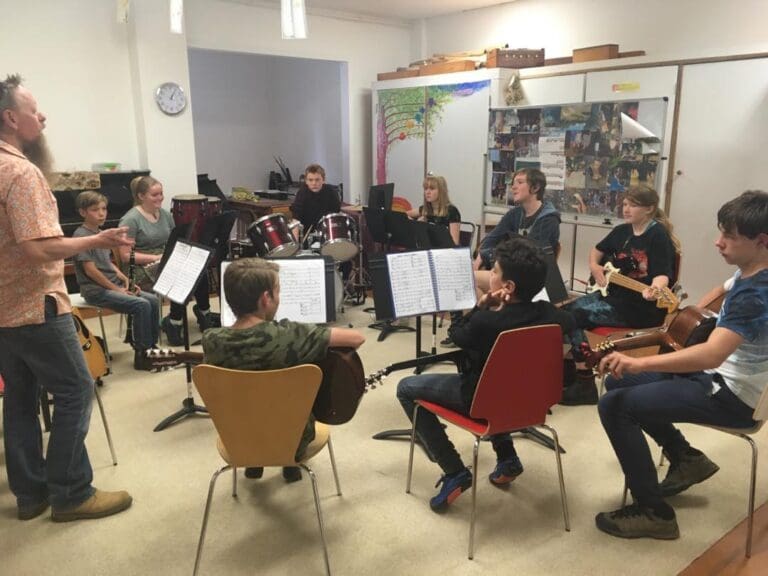 Students practise rhythmic connection and cooperation, creating music together as a vital community breath at Kindlehill.