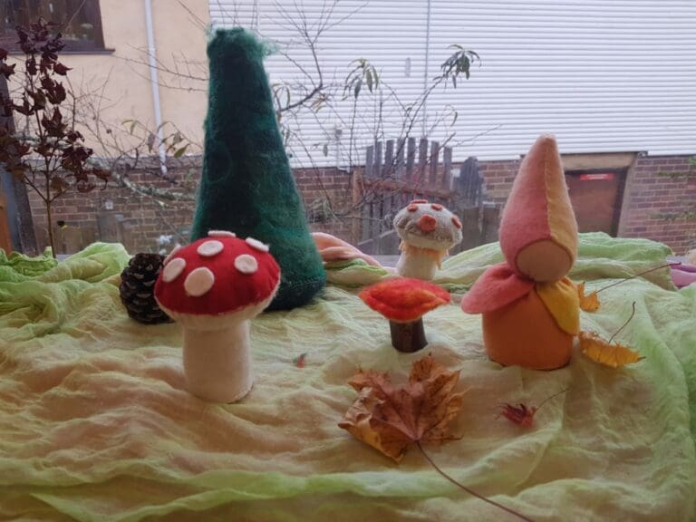 Handcrafted felt treasures and autumn leaves celebrate seasonal rhythms, awakening imagination and a deep connection to the land.