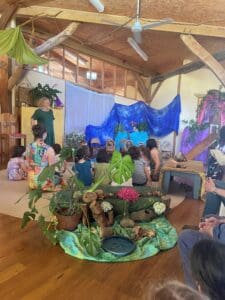 Families and children gather around a seasonal centrepiece, cultivating community spirit and a shared connection to Country.
