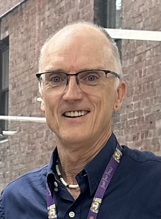 Smiling educator at the heart of our Kindlehill village, fostering connection and honouring every childs developmental journey.