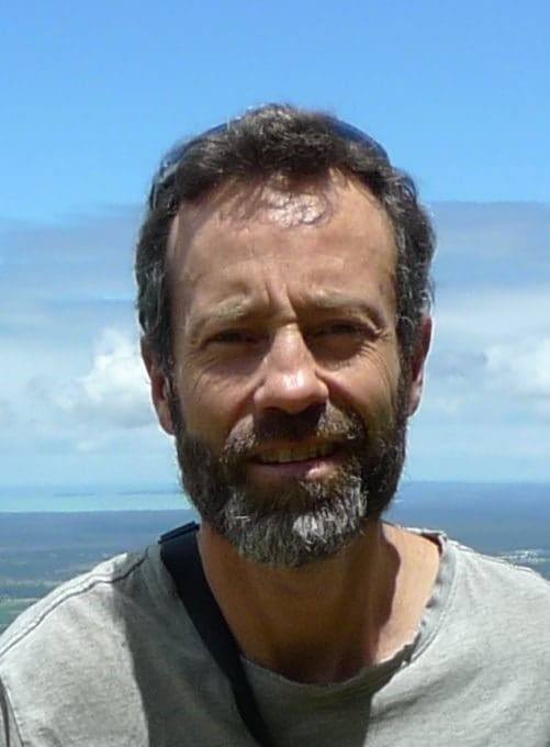A teacher stands amidst the Blue Mountains, honouring a profound connection with the land and the spirit of community.