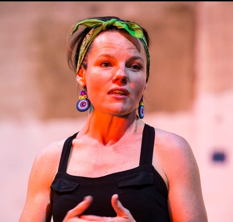 An expressive storyteller awakens imagination, fostering heart-centred connection and a culture of growth within the Kindlehill community.