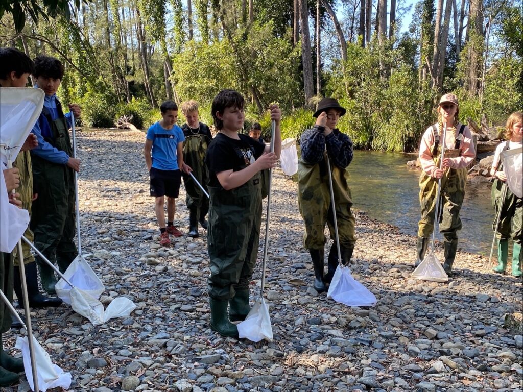 Students investigate local river life, honouring their connection to the land through immersive, hands-on learning in the bushland.
