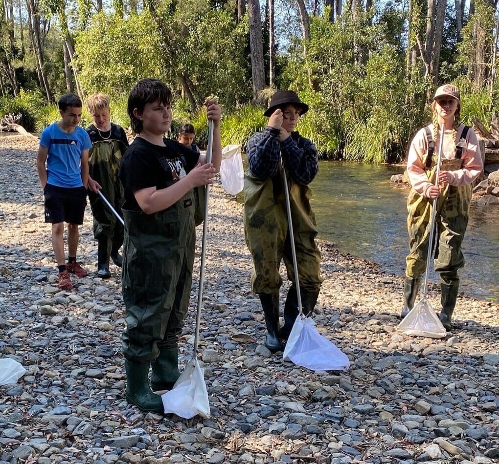 Students investigate local river life, honouring their connection to the land through immersive, hands-on learning in the bushland.