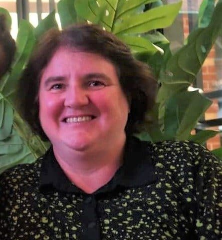 Radiant Kindlehill staff member embodies warmth and earth centredness, cultivating connection to others and the living world.