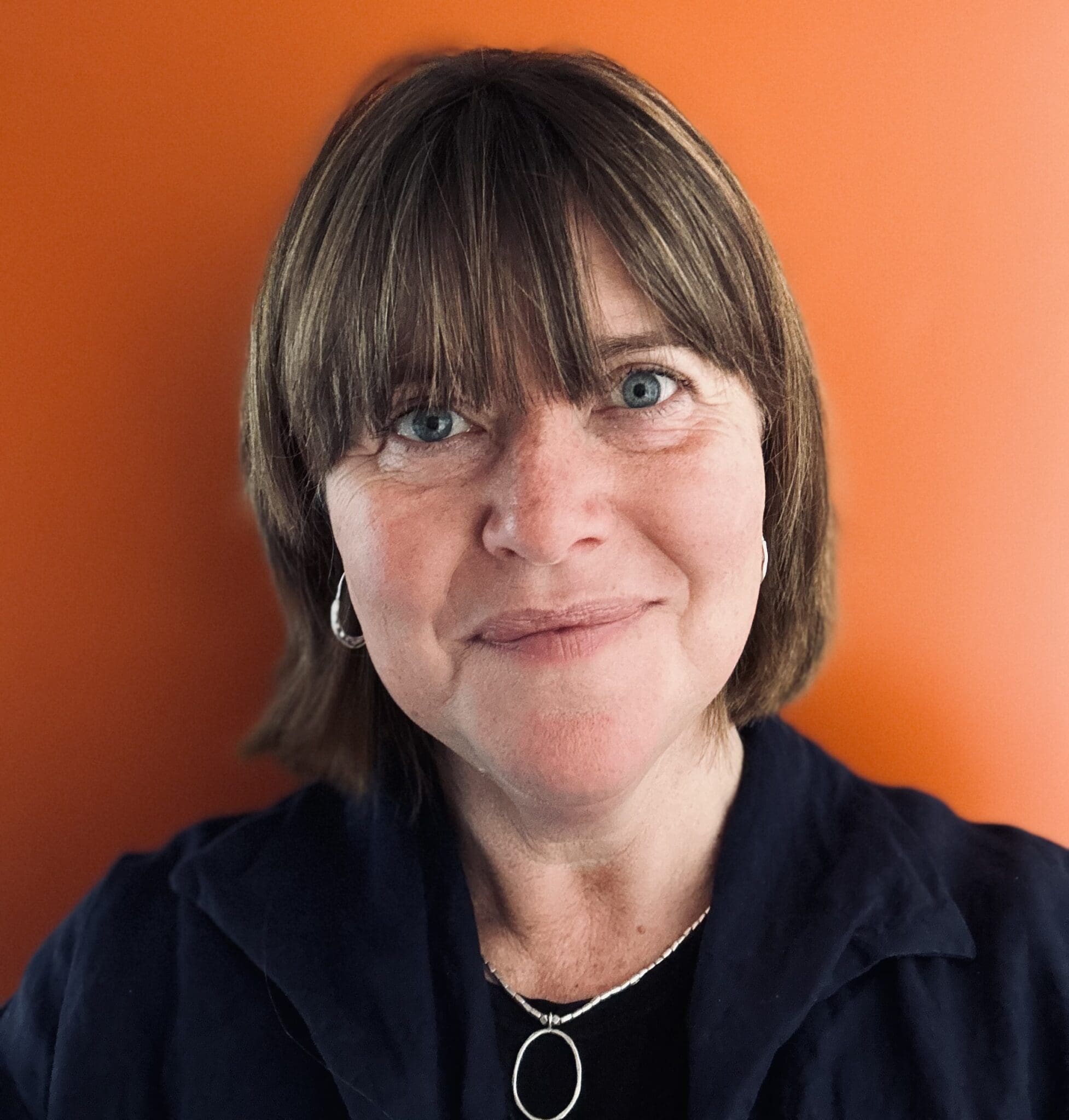 Kindlehill educator radiates warmth and compassion, reflecting a deep connection to community and the heart of our village.