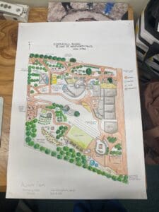 Hand-drawn permaculture plan weaving earth-centred learning through gardens, bushland, and community gathering spaces at Kindlehill School.