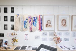 Hand-painted skateboards and botanical sketches express artistic growth, honouring student identity and connection to the land.