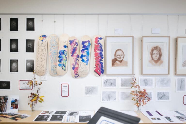 Hand-painted skateboards and botanical sketches express artistic growth, honouring student identity and connection to the land.