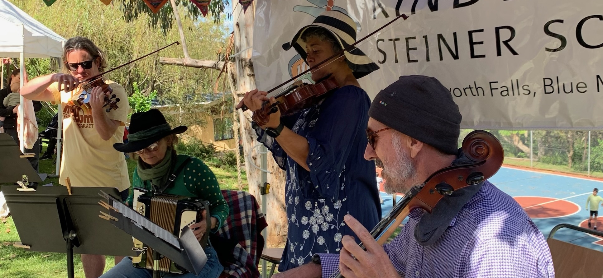 Kindlehill community musicians perform together, cultivating deep connection and a shared sense of purpose through inclusive musical collaboration.